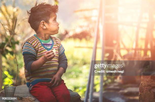 little hungry boy in poverty. - hungry teen stock pictures, royalty-free photos & images