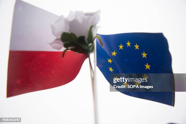 Polish and European Union flags are seen during a silent assembly named Stolen Justice in Krakow. Stolen Justice happening, intend to express...