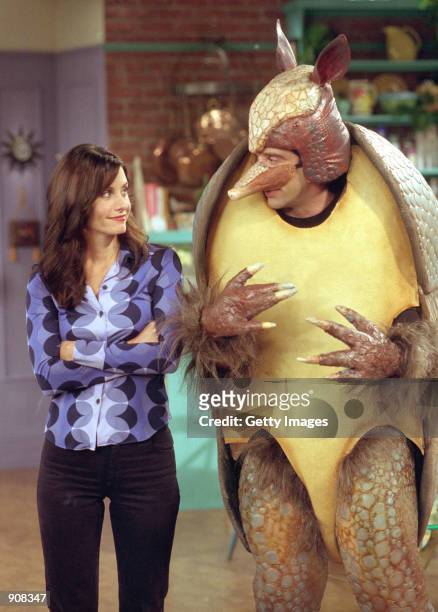Actors Courteney Cox Arquette as Monica Geller and David Schwimmer as Ross Geller in NBC's comedy series "Friends" episode "The One with the Holiday...