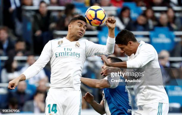 Carlos Casemiro of Real Madrid in action against Florin Andone of Deportivo La Coruna during the La Liga match between Real Madrid and Deportivo La...