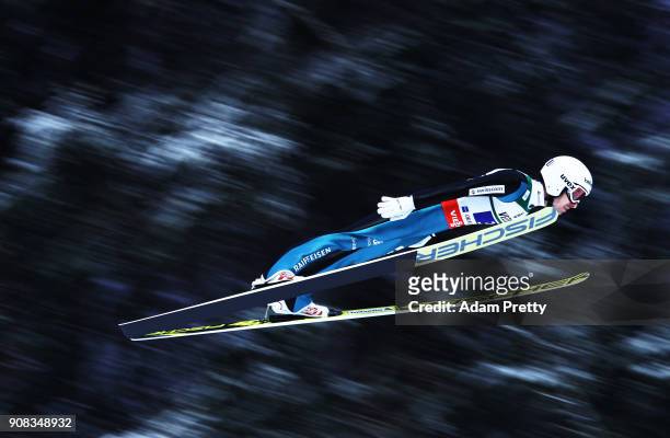 Simon Ammann of Switzerland soars through the air during his first competition jump of the Flying Hill Team competition of the Ski Flying World...