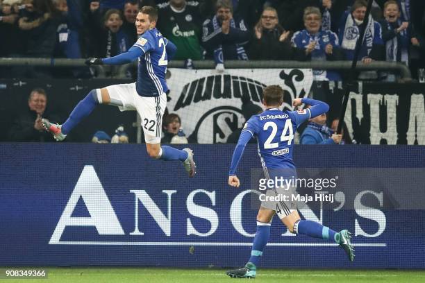 Marko Pjaca of Scalke celebrates with Bastian Oczipka after scoring his team's first goal to make it 1-0 during the Bundesliga match between FC...