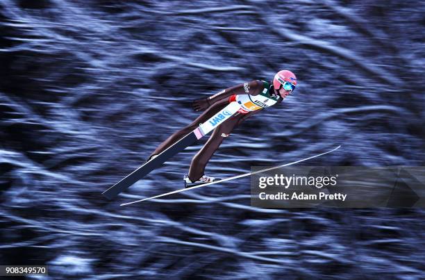 Dawid Kubacki of Poland soars through the air during his first competition jump of the Flying Hill Team competition of the Ski Flying World...