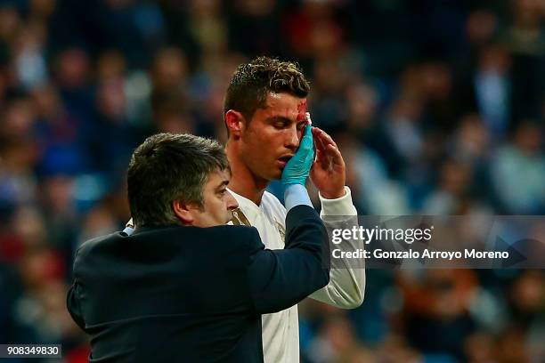 Cristiano Ronaldo of Real Madrid CF leaves the pitch after being damaged during the La Liga match between Real Madrid CF and Deportivo La Coruna at...