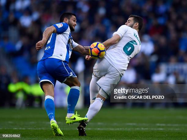 Real Madrid's Spanish defender Nacho Fernandez vies with Deportivo La Coruna's Romanian forward Florin Andone during the Spanish league football...