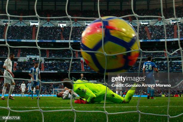 Cristiano Ronaldo of Real Madrid CF falls to the ground after scoring their sixth goal during the La Liga match between Real Madrid CF and Deportivo...