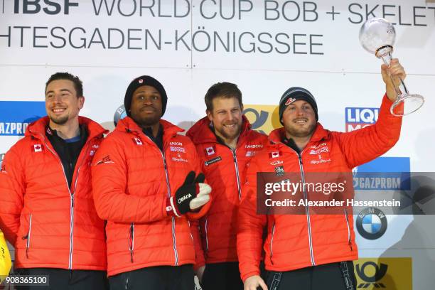 Justin Kripps of Canada celebrates winning the Overall World Cup with Alexander Kopacz, Jesse Lumsden and Oluseyi Smith at Deutsche Post Eisarena...