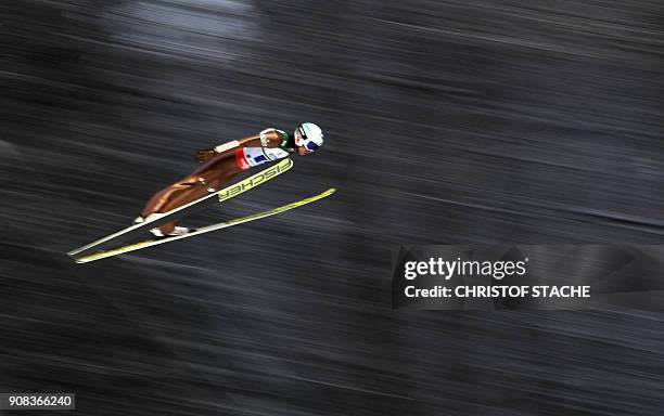 Poland's Kamil Stoch soars through the air during his team event's first competition jump at the ski-flying world championships in Oberstdorf,...