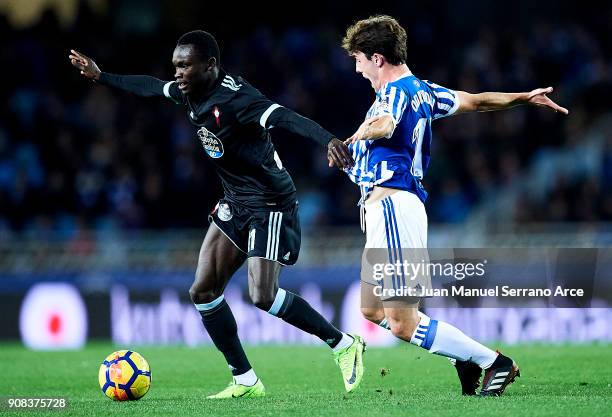 Pione Sisto of RC Celta de Vigo duels for the ball with Alvaro Odriozola of Real Sociedad during the La Liga match between Real Sociedad de Futbol...