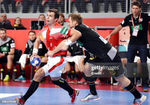 Denmark's Rasmus Schmidt Lauge vies with Germany's Steffen Weinholdn during the group II match of the Men's 2018 EHF European Handball Championship...