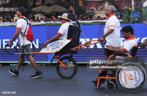 Participants run Champion with Disability during the Tata Mumbai Marathon 2018 at CSMT on January 21, 2018 in Mumbai, India.