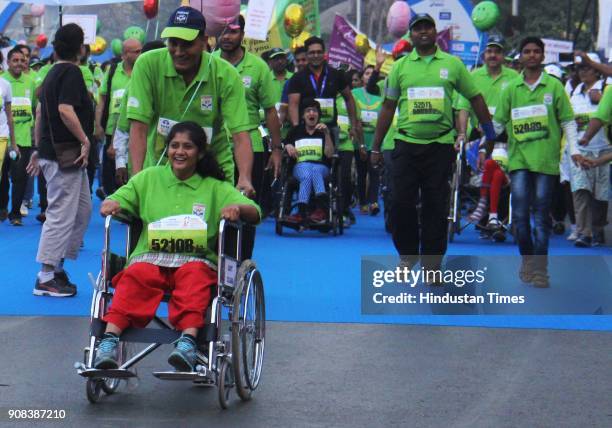 Participants run Champion with Disability during the Tata Mumbai Marathon 2018 at CSMT on January 21, 2018 in Mumbai, India.