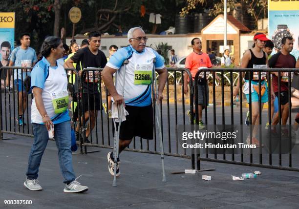 Participants with Crutches runs for Mumbai Marathon early morning near Azad Maidan on January 21, 2018 in Mumbai, India.
