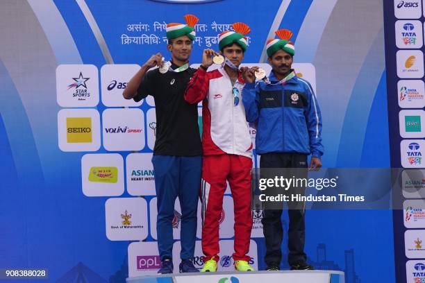 Shankar Man , Pradeep Singh and Deepak Kumbhar winner of men's Half marathon on January 21, 2018 in Mumbai, India.