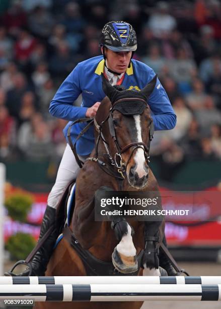 Christian Ahlmann of Germany competes on his horse "Taboulet Z" during the Leipzig "Partner Pferde" stage of the FEI World Cup horse jumping...