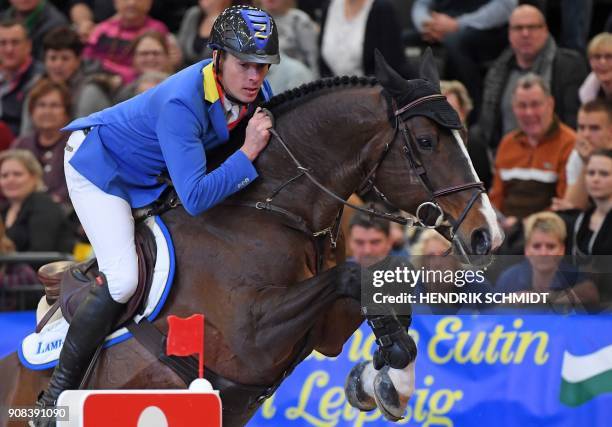 Christian Ahlmann of Germany competes on his horse "Taboulet Z" during the Leipzig "Partner Pferde" stage of the FEI World Cup horse jumping...