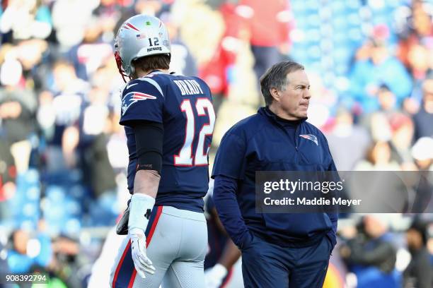 Tom Brady of the New England Patriots and head coach Bill Belichick look on during warm ups before the AFC Championship Game against the Jacksonville...