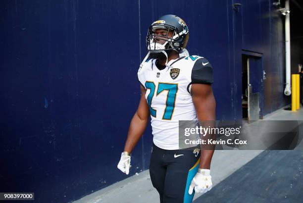 Leonard Fournette of the Jacksonville Jaguars walks onto the field before the AFC Championship Game against the New England Patriots at Gillette...