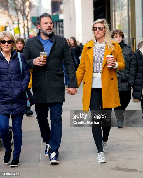 Ben Affleck and Lindsay Shookus enjoy coffee while holding hands on January 21, 2018 in New York City.