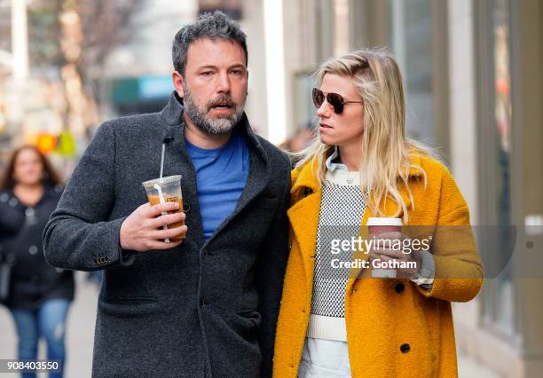 Ben Affleck and Lindsay Shookus enjoy coffee while holding hands on January 21, 2018 in New York City.