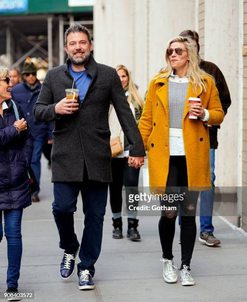 Ben Affleck and Lindsay Shookus enjoy coffee while holding hands on January 21, 2018 in New York City.