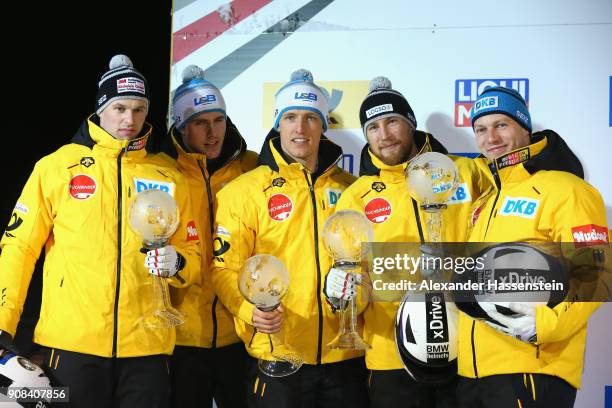 Francesco Friedrich of Germany celebrates with Candy Bauer, Martin Grothkopp and Thorsten Margis at Deutsche Post Eisarena Koenigssee winning the 2nd...