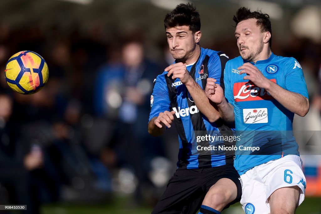 Riccardo Orsolini (L) of Atalanta BC competes for the ball...