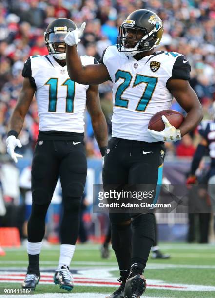 Leonard Fournette of the Jacksonville Jaguars celebrates with Marqise Lee after a touchdown in the second quarter during the AFC Championship Game...
