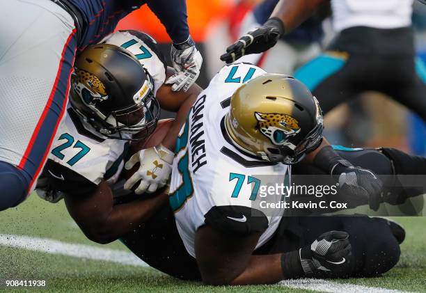 Leonard Fournette of the Jacksonville Jaguars scores a touchdown in the second quarter during the AFC Championship Game against the New England...