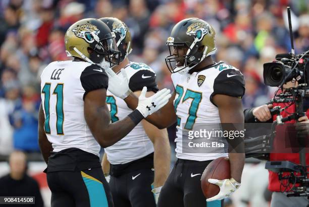 Leonard Fournette of the Jacksonville Jaguars celebrates with teammates after a touchdown in the second quarter during the AFC Championship Game...