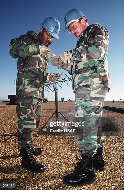 Senior Airman Carl Peguese and Technical Sergeant James McLean, members of the 27th Fighter Wing, Wing Initial Communication Package, Cannon Air...