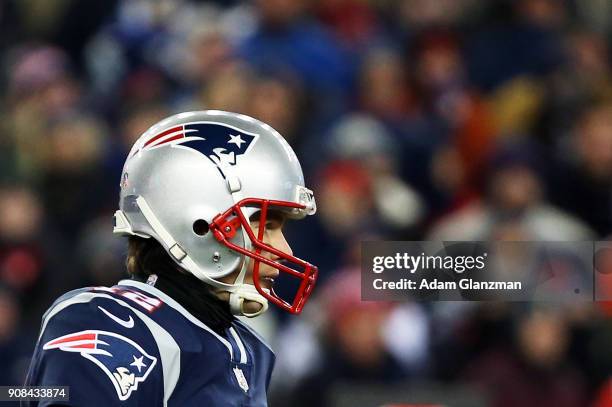 Tom Brady of the New England Patriots looks on during the AFC Divisional Playoff game against the Tennessee Titans at Gillette Stadium on January 13,...