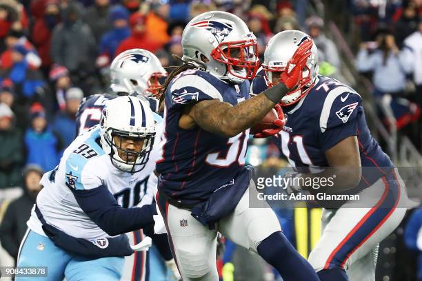 Brandon Bolden of the New England Patriots carries the ball during the third quarter in the AFC Divisional Playoff game against the Tennessee Titans...