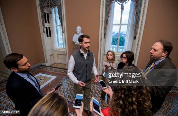 Sen. Tom Cotton, R-Ark., speaks with reporters in the Capitol as the government shutdown continues on Sunday, Jan. 21, 2018.