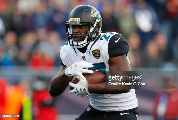 Leonard Fournette of the Jacksonville Jaguars carries the ball in the first half during the AFC Championship Game against the Jacksonville Jaguars at...