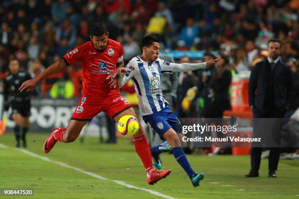 Francisco Rodriguez of Lobos BUAP fights for the ball against Erik Aguirre of Pachuca during the 3rd round match between Pachuca and Lobos BUAP as...