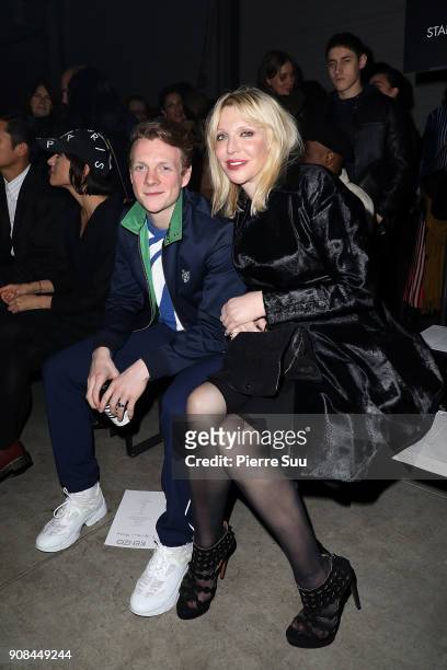 Patrick Gibson and Courtney Love attend the Kenzo Menswear Fall/Winter 2018-2019 show as part of Paris Fashion Week on January 21, 2018 in Paris,...
