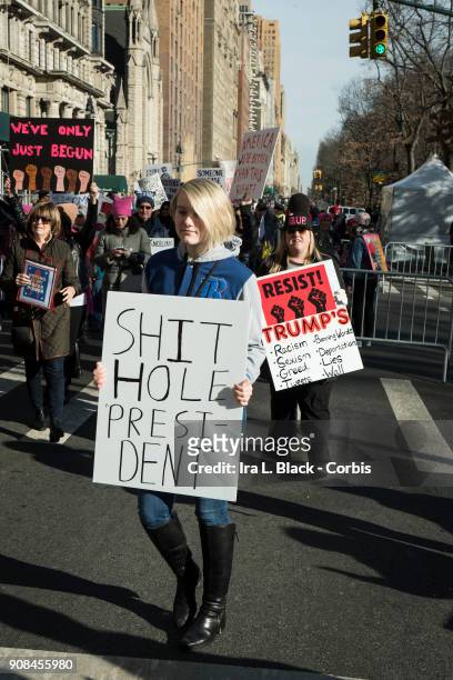 Demonstrator holds up a banner saying "Shithole for President" during the second annual Women's March in the borough of Manhattan in New York City,...
