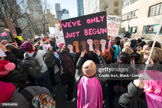 Demonstrator holds up a banner saying "We've Only Just Begun" during the second annual Women's March in the borough of Manhattan in New York City,...