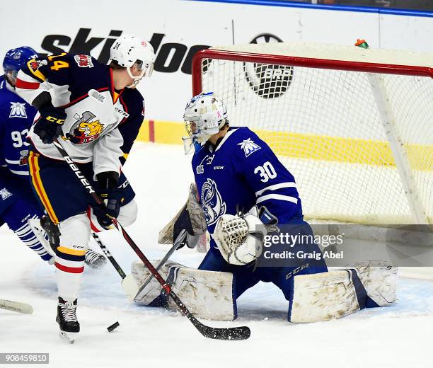 Emanuel Vella of the Mississauga Steelheads stops a shot against Andrei Svechnikov of the Barrie Colts during OHL game action on January 19, 2018 at...