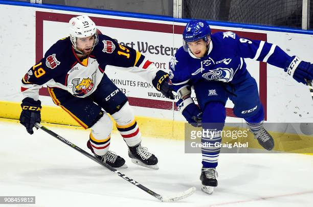 Michael McLeod of the Mississauga Steelheads turns up ice against Jason Wilms of the Barrie Colts during OHL game action on January 19, 2018 at...