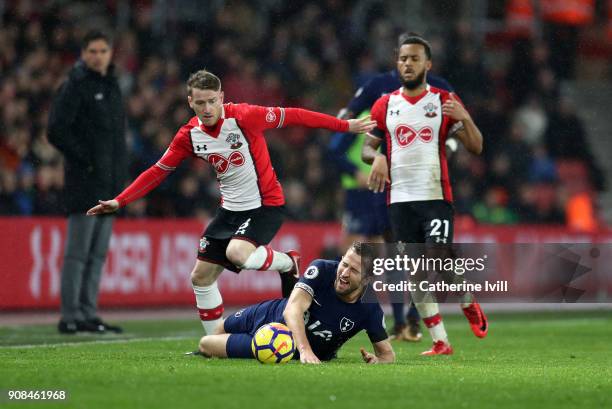 Harry Kane of Tottenham Hotspur is tackled by Steven Davis of Southampton during the Premier League match between Southampton and Tottenham Hotspur...