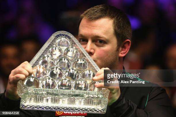 Mark Allen kisses the trophy as he celebrates victory following The Dafabet Master Final between Kyren Wilson and Mark Allen at Alexandra Palace on...