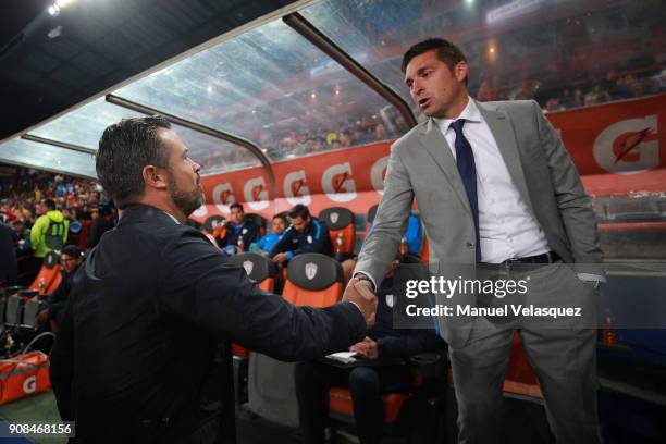 Rafael Puente , Coach of Lobos BUAP and Diego Alonso , Coach of Pachuca, shake hands prior the 3rd round match between Pachuca and Lobos BUAP as part...