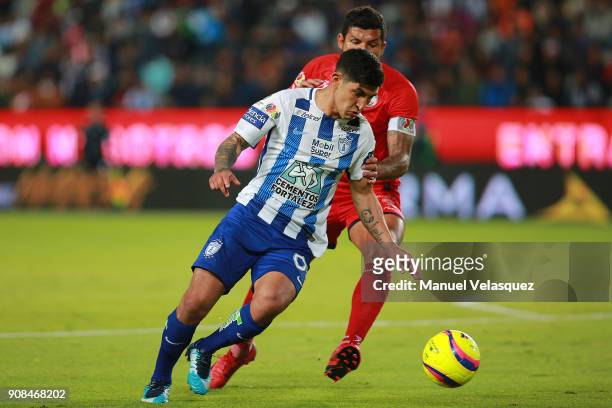 Victor Guzman of Pachuca struggles for the ball against Francisco Rodriguez of Lobos BUAP during the 3rd round match between Pachuca and Lobos BUAP...