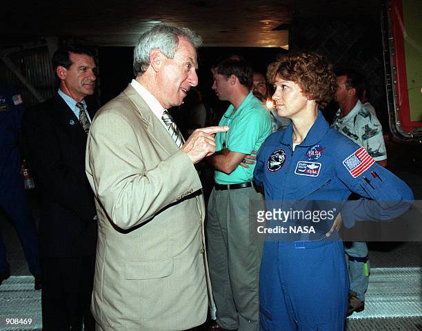 At the Shuttle Landing Facility, NASA Administrator Daniel Goldin talks with STS-93 Commander Eileen Collins beside the Space Shuttle orbiter...