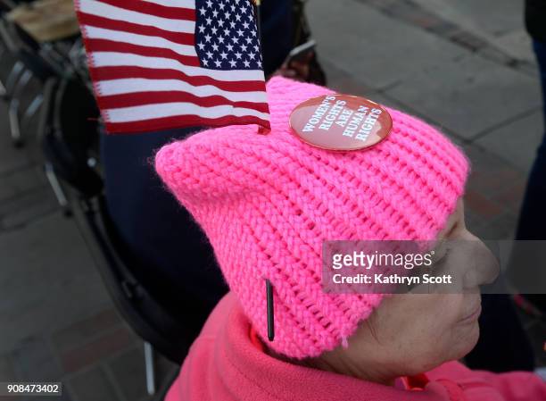 Peggy Hester from Littleton joins thousands of marchers as they listen to speakers at a rally in Civic Center Park following the second Women's March...