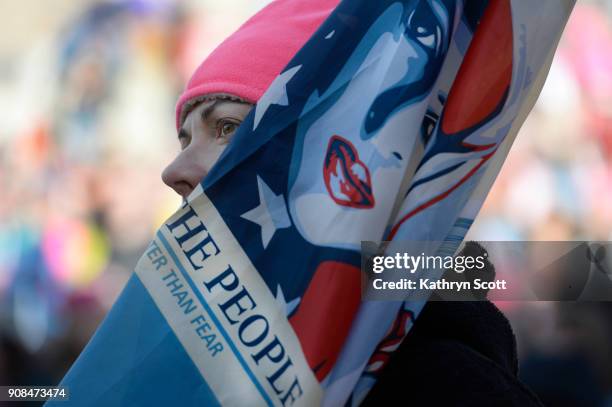 Sarah Taylor from Lafayette joins thousands of marchers as they listen to speakers at a rally in Civic Center Park following the second Women's March...