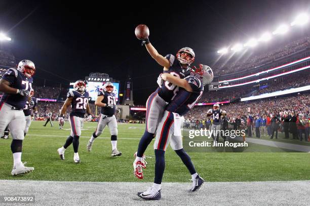 Danny Amendola of the New England Patriots celebrates a touchdown with Chris Hogan in the fourth quarter during the AFC Championship Game against the...