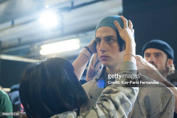 Model prepares backstage prior to the Sankuanz Menswear Fall/Winter 2018-2019 show as part of Paris Fashion Week on January 21, 2018 in Paris, France.